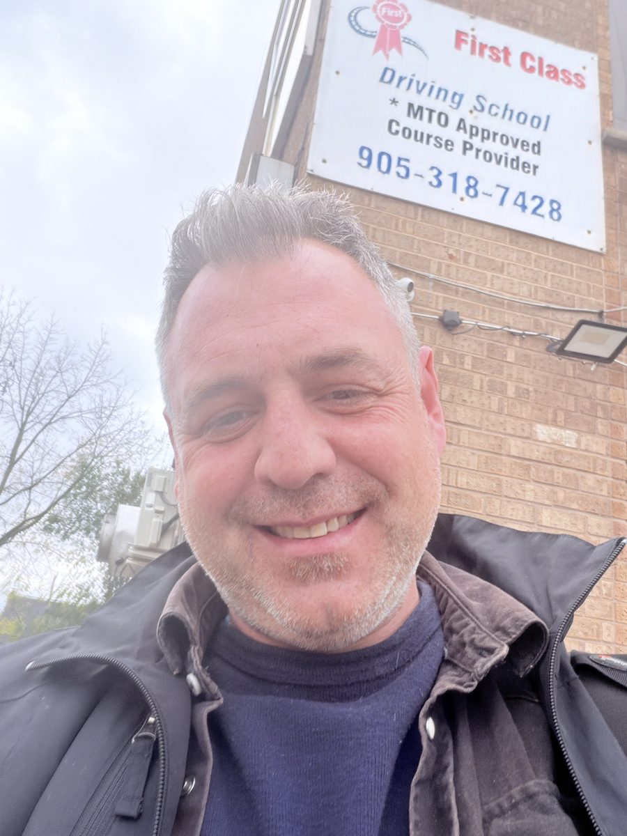 Anthony McGrath Tooton IV smiling in a selfie outdoors